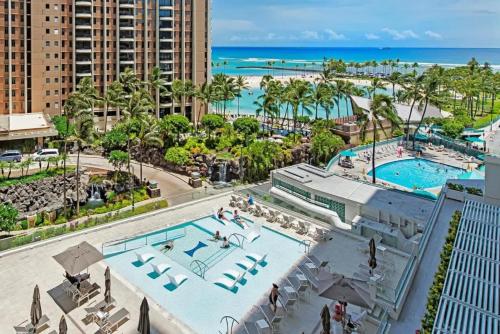an aerial view of a resort with two pools and the beach at Panoramic Oceanview Resort - Full Kitchen in Each Unit, 2 Swimming Pools, Onsite Restaurants, Fireworks Every Friday in Honolulu