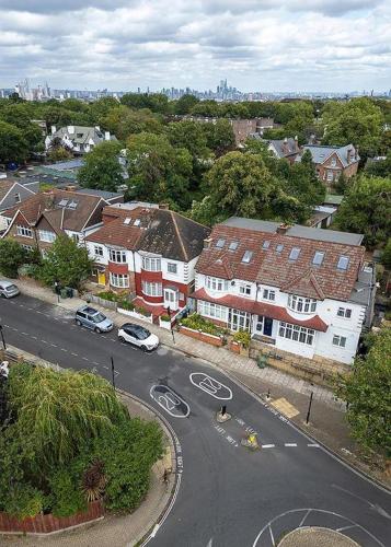 an aerial view of a town with houses and a street at Wavertree Hotel in London