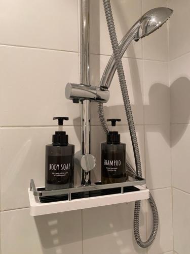 a bathroom shelf with two products on it at Bellagio Cool Flat - Private Parking & Rooftop terrace in Bellagio