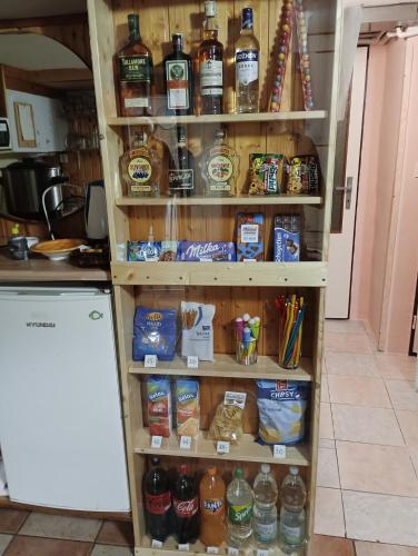 a pantry filled with lots of bottles of alcohol at Horská chata LADA in Loučná pod Klínovcem
