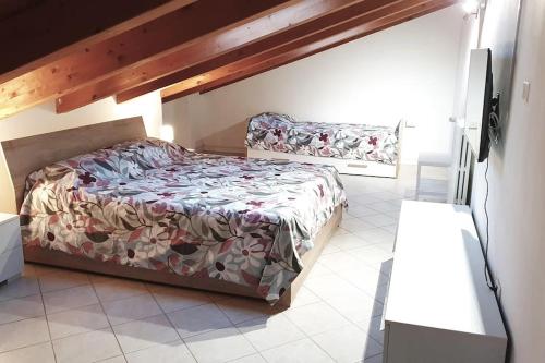 Ένα ή περισσότερα κρεβάτια σε δωμάτιο στο Apartment A&D Home Imola