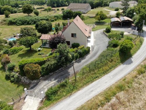 an aerial view of a house and a road at Lou Raspaillou in Issigeac
