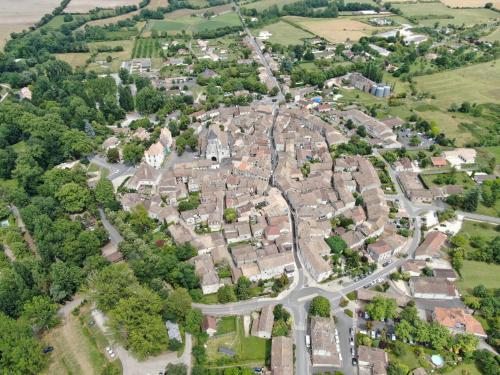 an aerial view of a city with houses at Lou Raspaillou in Issigeac