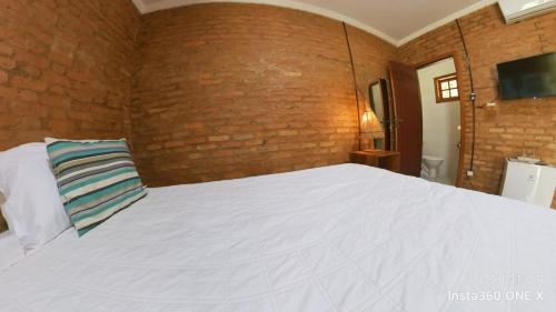 Letto o letti in una camera di Vila das Mangabeiras Corumbau