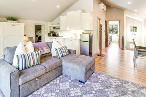 a living room with a couch and a kitchen at Near Big Wood River with Trail Access Updated Home! in Hailey
