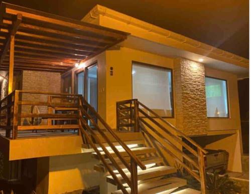 a house with stairs leading up to it at Rent Suite Jama Manabí Deluxe in Jama