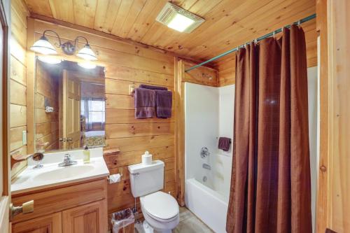 a bathroom with a toilet and a sink and a shower at Cabin on 22 Acres with Patio - 3 Mi to Blowing Rock! in Lenoir