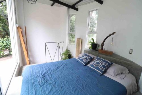 Postel nebo postele na pokoji v ubytování Casita Passiflora