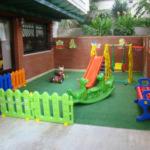 a childs play area with a toy playground at Nazar Hotel in Didim