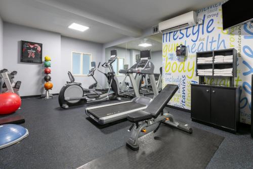a gym with several exercise equipment in a room at Holiday Inn Express Spokane-Valley by IHG in Spokane Valley