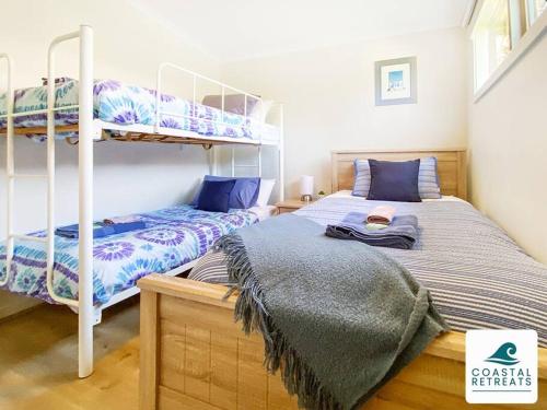 Postel nebo postele na pokoji v ubytování Moya's Villa - Phillip Island Cowes Resort Escape