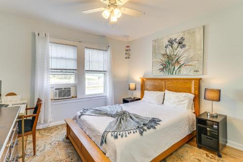 a bedroom with a bed and a ceiling fan at Beachfront, Dog-Friendly Milford Getaway with Yard! in Milford
