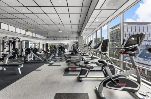 a gym with a lot of treadmills and ellipticals at Oasis in heart of Hollywood in Los Angeles