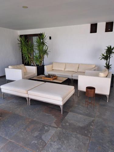 a living room with white couches and a table at HC LUXURY CELAVELLa in Playa Blanca