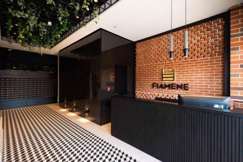 a food counter in a restaurant with a brick wall at Wanderer estilo boho chic in Las Victorias