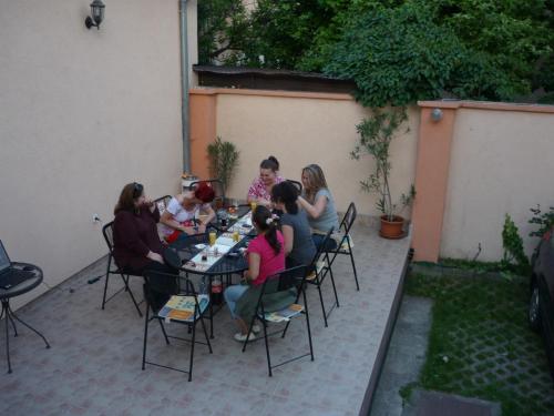 a group of people sitting at a table at Jáde Panzió in Budapest