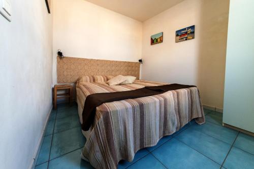 Ένα ή περισσότερα κρεβάτια σε δωμάτιο στο Cortile San Giovanni