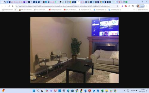 a living room with a couch and a table at Main floor room 4, 22 minute from airport in Edmonton