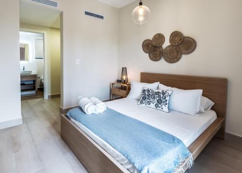 a bedroom with a large bed in a room at Vista Cana Rooftop Picuzzy Apartment in Punta Cana