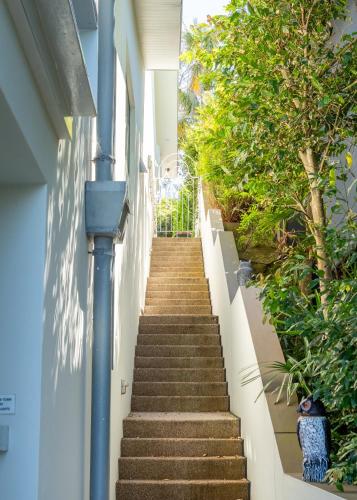 a stairway leading up to a building at Balmoral Beach Beauty in Sydney