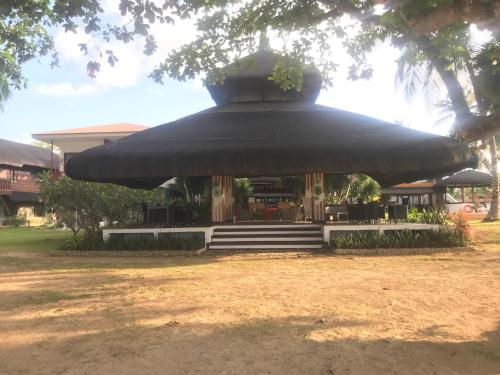 a gazebo with a planter on top of it at The Ananyana Beach Resort by SMS Hospitality in Panglao