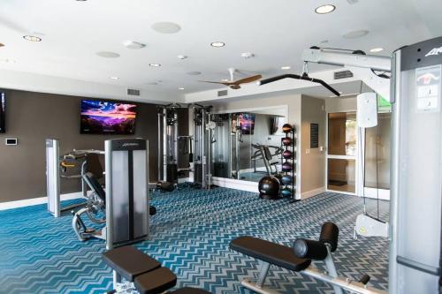 a fitness room with a gym with tread machines at 3 Miles to Disney Heated Pool CnvntnCtr Jacuzzi in Fullerton
