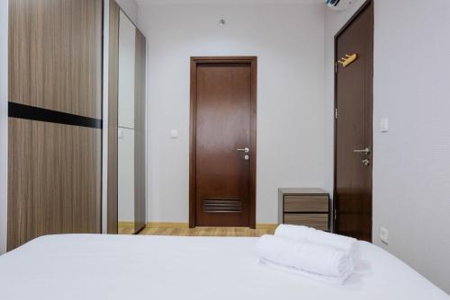 Ένα ή περισσότερα κρεβάτια σε δωμάτιο στο Exclusive 1BR at Serpong M-town Signature Apartment By Travelio
