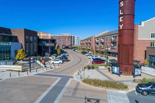 a city street with cars parked in a parking lot at Beautiful home near Carowinds, Ballantyne in Fort Mill