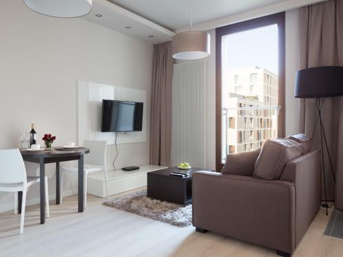 Televízia a/alebo spoločenská miestnosť v ubytovaní Chopin Apartments - City