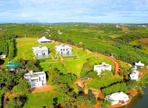 an aerial view of a large house on a field at Du Lịch Lâm Hà - Hồ Gia Trang Villas in Lam Ha