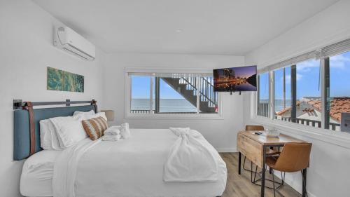 Ένα ή περισσότερα κρεβάτια σε δωμάτιο στο The Marbella