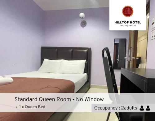 Postel nebo postele na pokoji v ubytování Hilltop Hotel Tanjung Malim