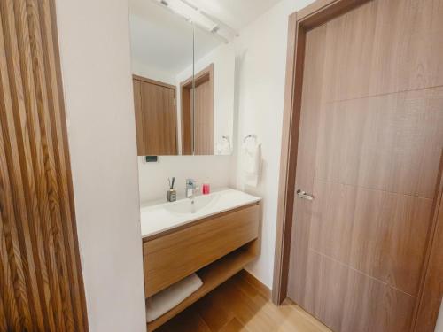 a bathroom with a sink and a mirror at Downtown Punta Cana Central Park 1 Bedroom & Sofa Bed B-302-2 in Punta Cana