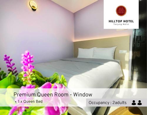 Postel nebo postele na pokoji v ubytování Hilltop Hotel Tanjung Malim