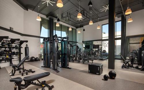 a gym with a lot of treadmills and machines at Apart Hotel near Dodgers Stadium in Los Angeles