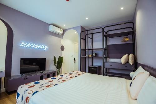 Кровать или кровати в номере Palette Collect's Boutique Hotel Ha Long