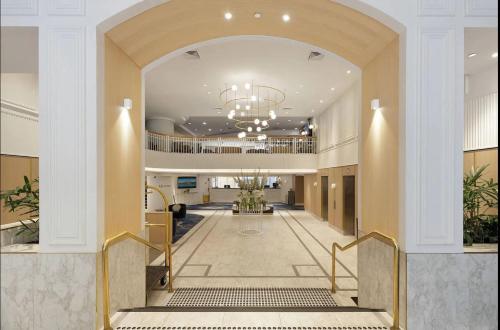 a lobby of a hotel with a hallway with a staircase at Fancy home with water view in the rocks in Sydney