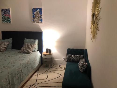 Ένα ή περισσότερα κρεβάτια σε δωμάτιο στο Bel appartement cosy et baroque