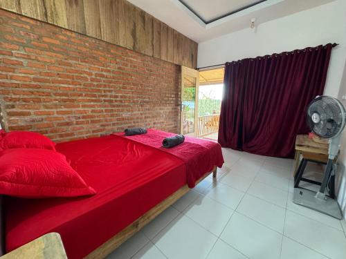 Postel nebo postele na pokoji v ubytování Simagirau Homestay