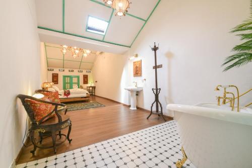 a bathroom with a sink and a bath tub at Ohana House-H3 in Melaka