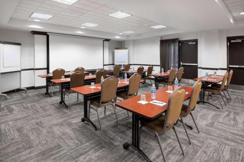a classroom with tables and chairs in a room at Hyatt Place Mystic in Mystic