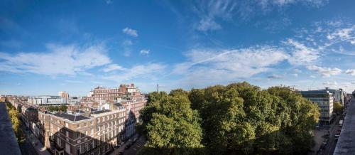 a view of a city with buildings and trees at Hyatt Regency London - The Churchill in London