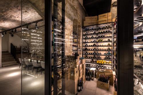 a wine tasting room with a wall of wine bottles at Studio 9 in Fulda