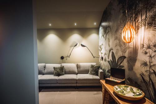 a living room with a couch and a table at Hotel Ederstrand in Frankenberg