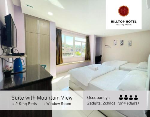 Postel nebo postele na pokoji v ubytování Hilltop Hotel Tanjung Malim