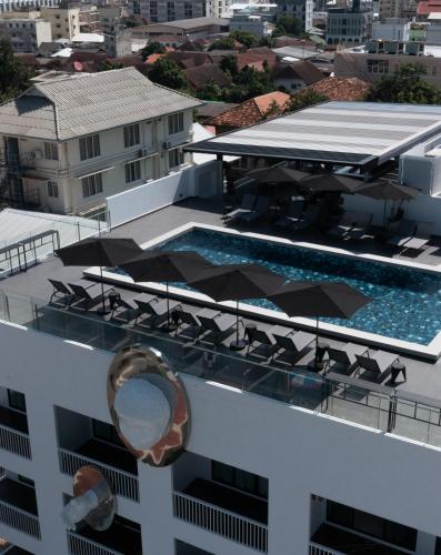 a swimming pool on the roof of a building at The StandardX, Bangkok Phra Arthit in Bangkok