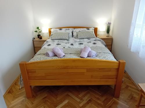 Postel nebo postele na pokoji v ubytování Apartmani Ani