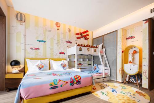 a childs bedroom with a bed and a map at Suzhou International Conference Hotel in Suzhou