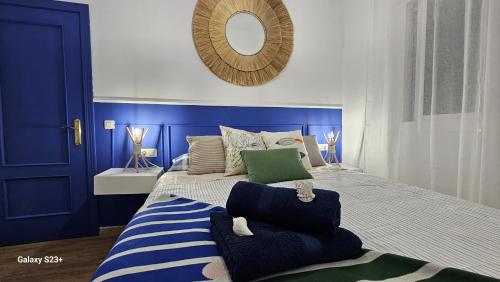 a blue and white bedroom with a large bed at Apartamento Blue Garrucha in Garrucha