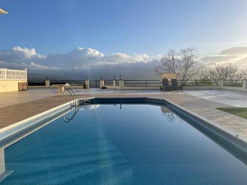 a swimming pool on the roof of a building at Letymvou Terrace in Letimbou